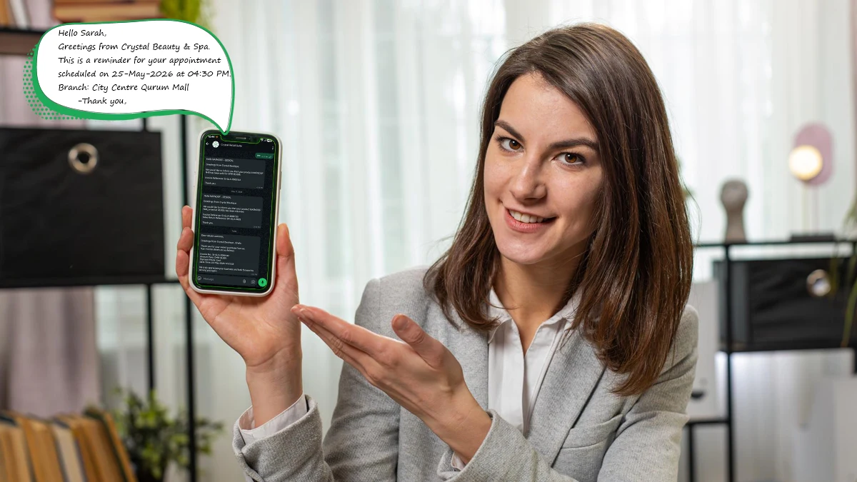 Salon receptionist in Muscat viewing automated WhatsApp messages sent to clients through Crystal software